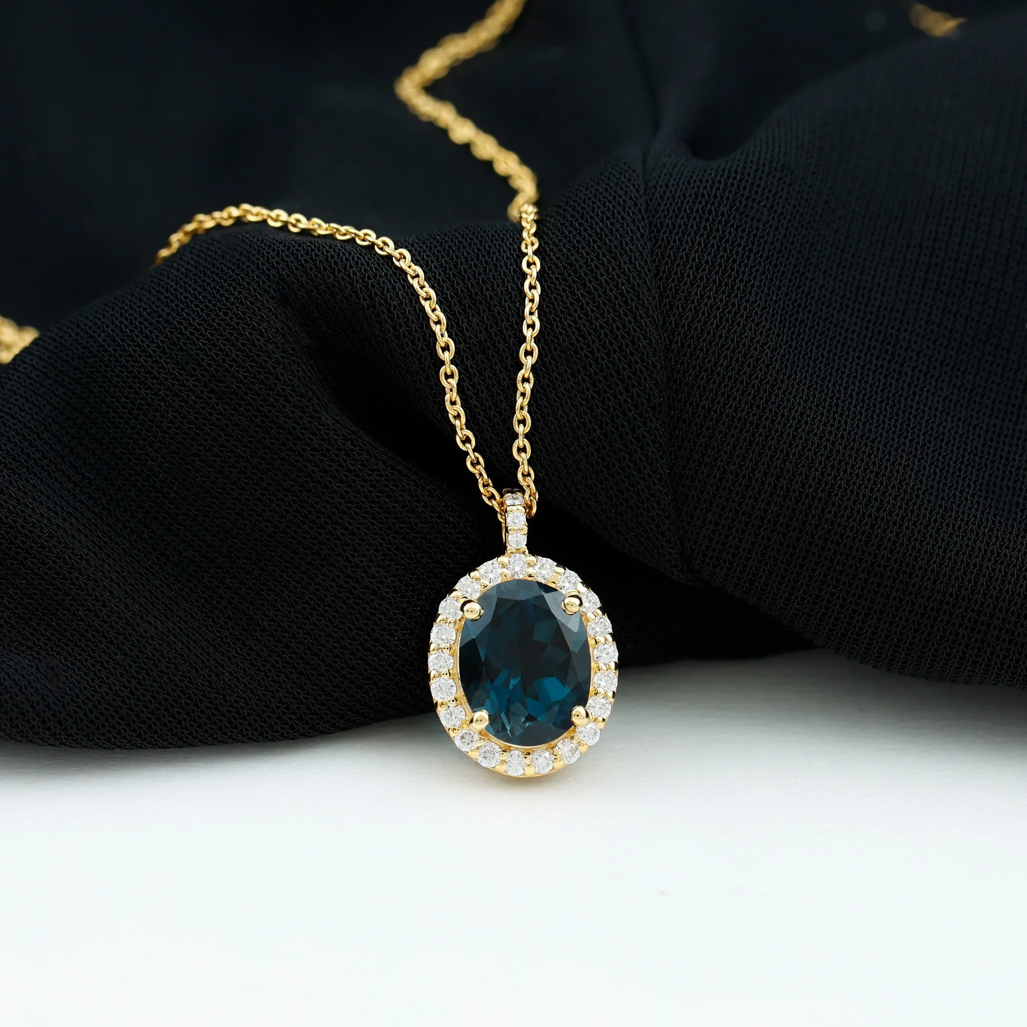 3 CT Oval Cut London Blue Topaz and Diamond Halo Pendant