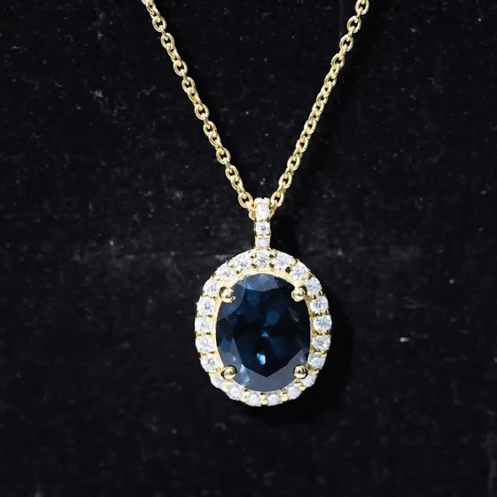 3 CT Oval Cut London Blue Topaz and Diamond Halo Pendant