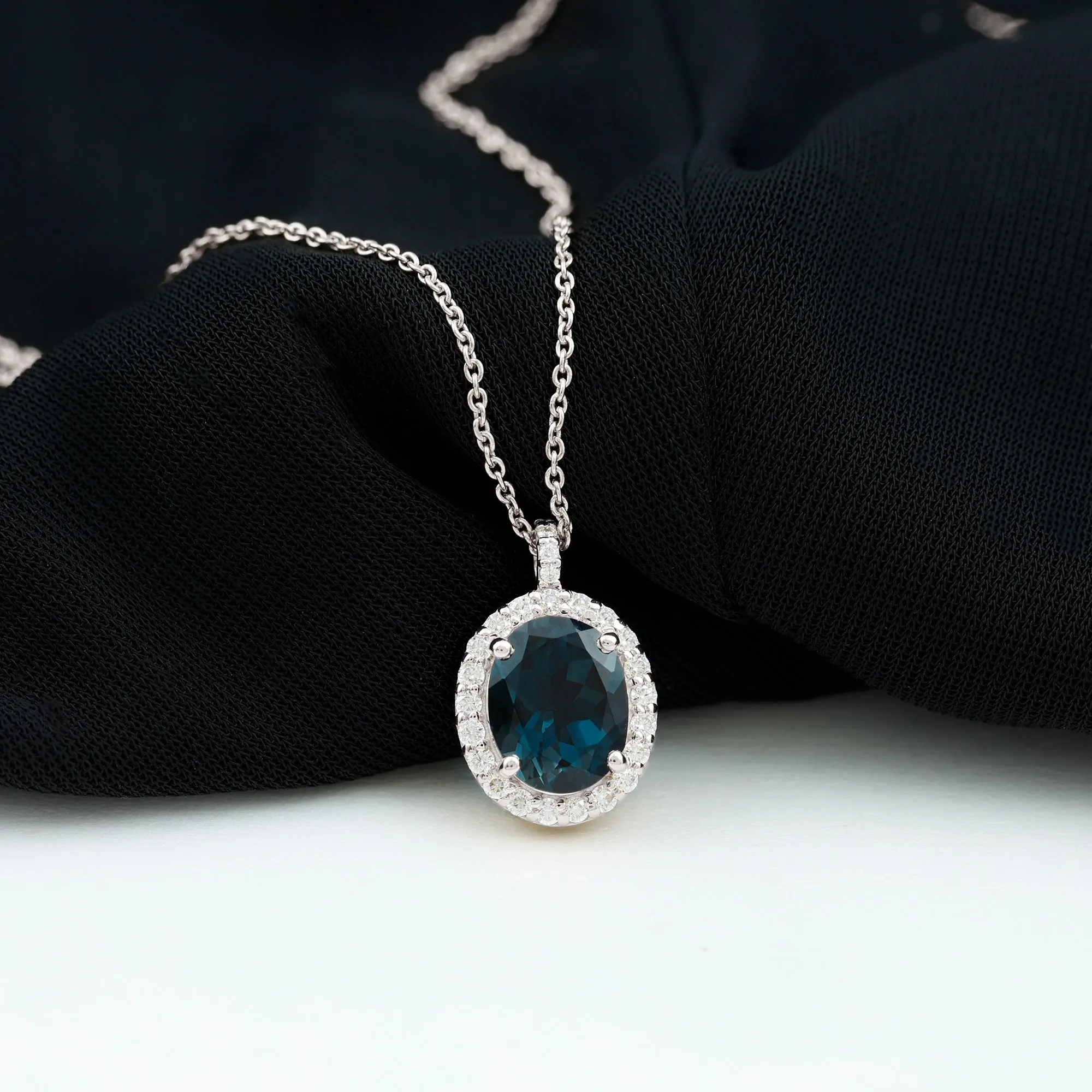 3 CT Oval Cut London Blue Topaz and Diamond Halo Pendant