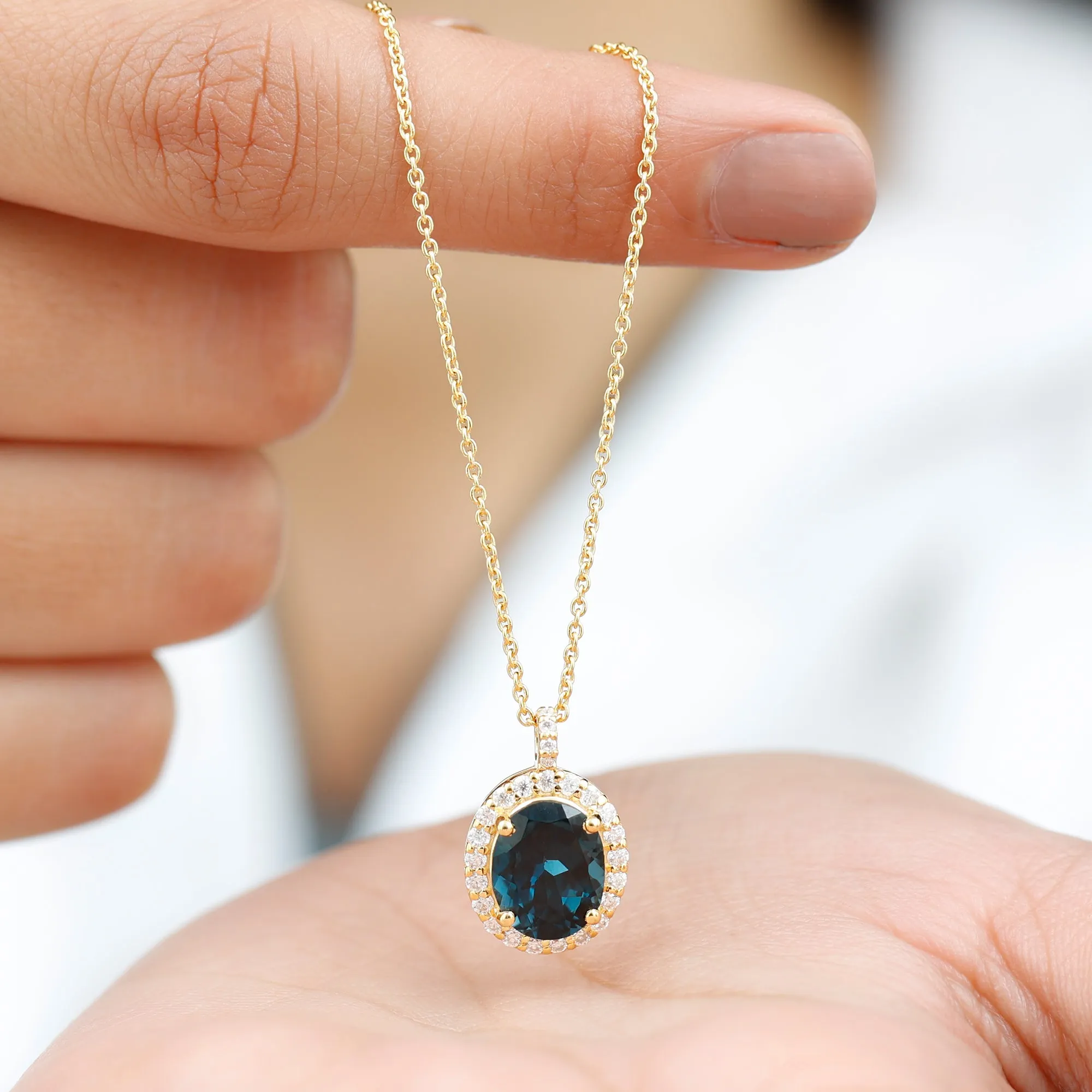 3 CT Oval Cut London Blue Topaz and Diamond Halo Pendant