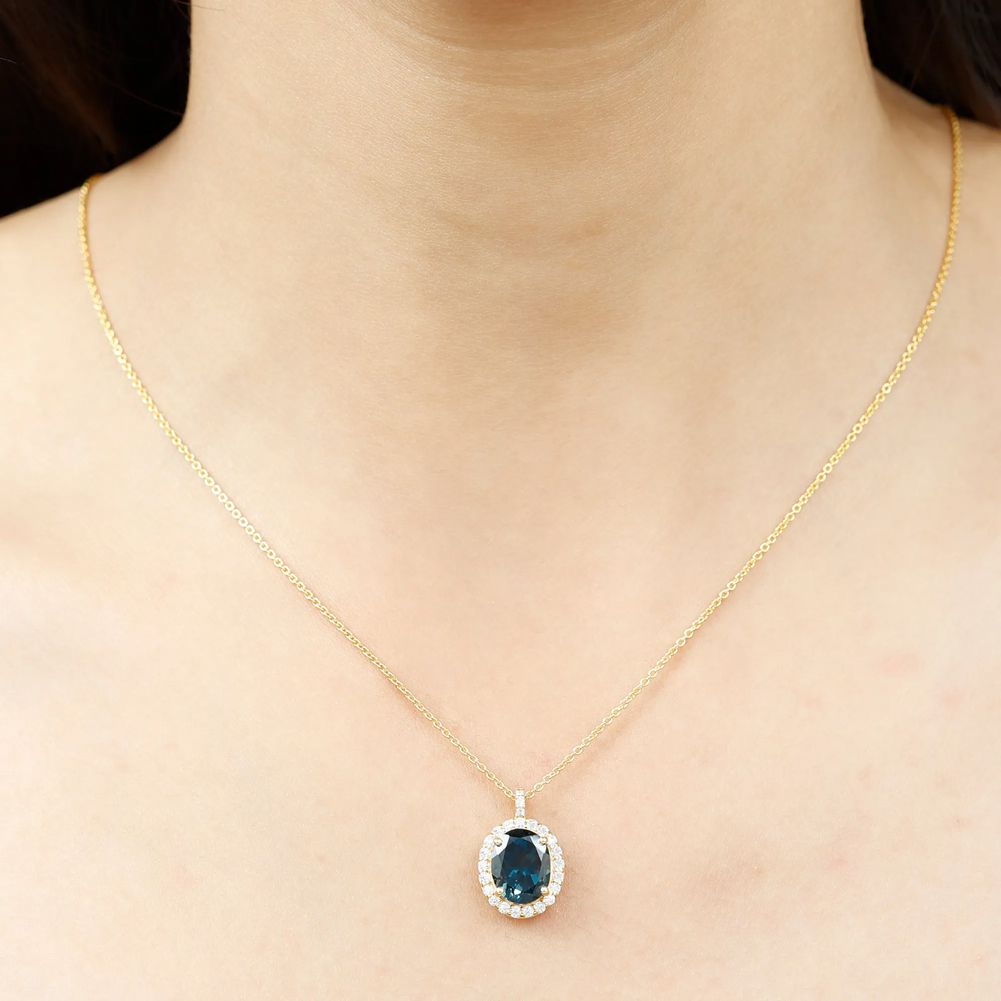 3 CT Oval Cut London Blue Topaz and Diamond Halo Pendant