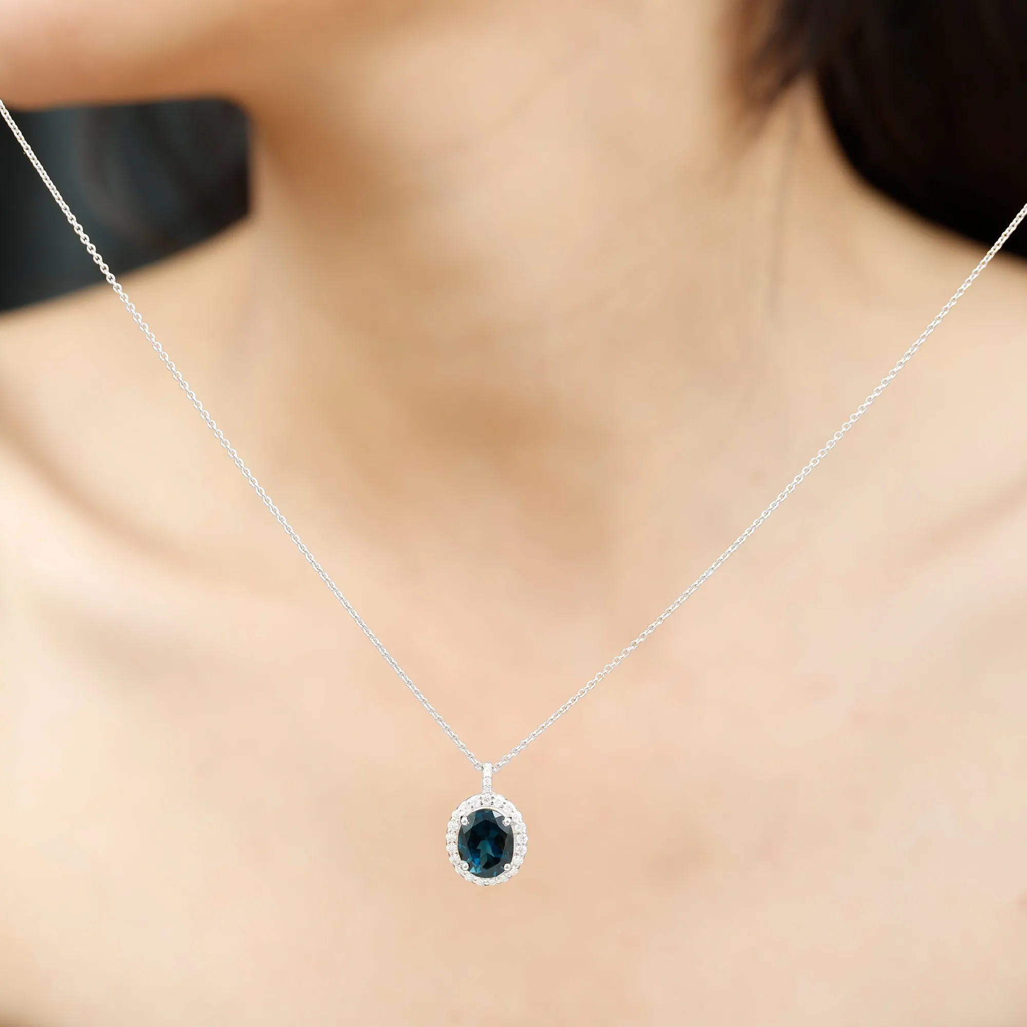 3 CT Oval Cut London Blue Topaz and Diamond Halo Pendant