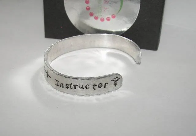 Behind every nurse is a great instructor Nurses instructor gift,  custom hand stamped cuff bracelet, gift for nursing graduation