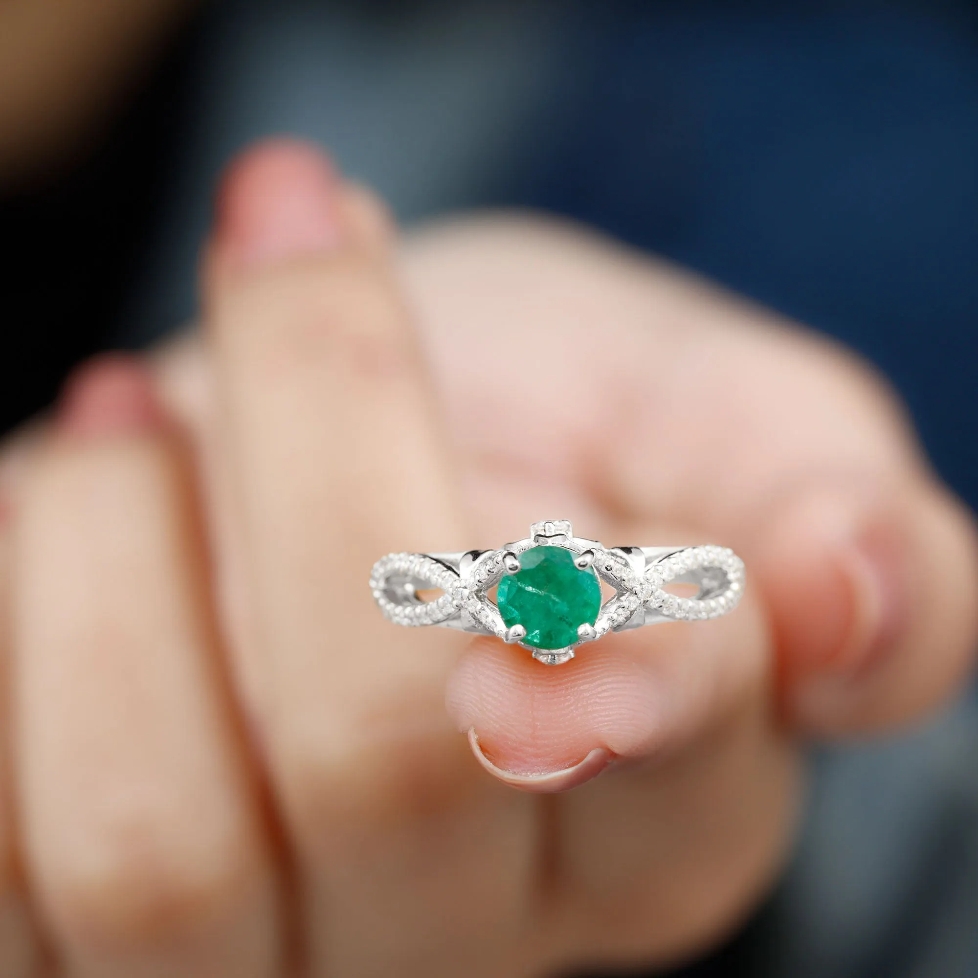Emerald Crossover Engagement Ring with Diamond