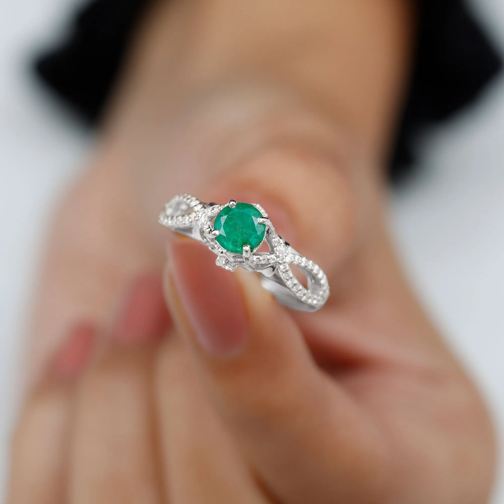 Emerald Crossover Engagement Ring with Diamond
