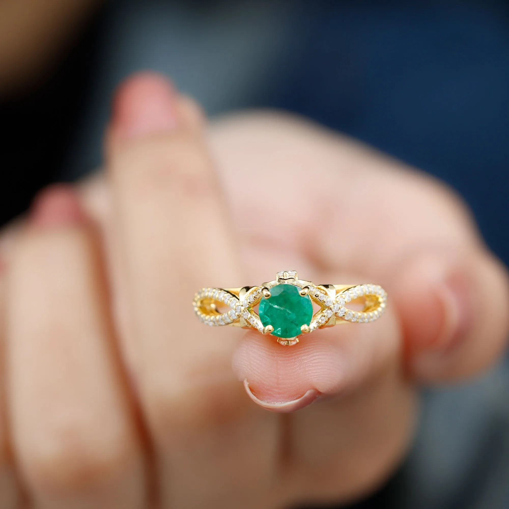 Emerald Crossover Engagement Ring with Diamond