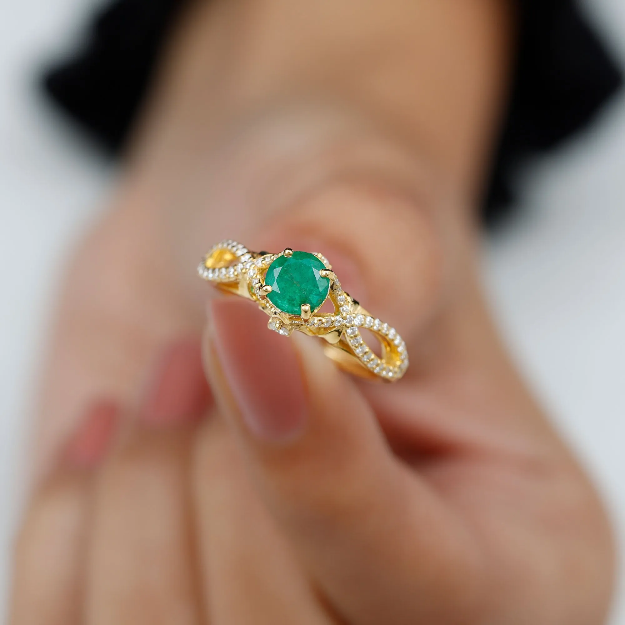 Emerald Crossover Engagement Ring with Diamond