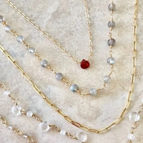 Gold Necklace with Garnet Drop