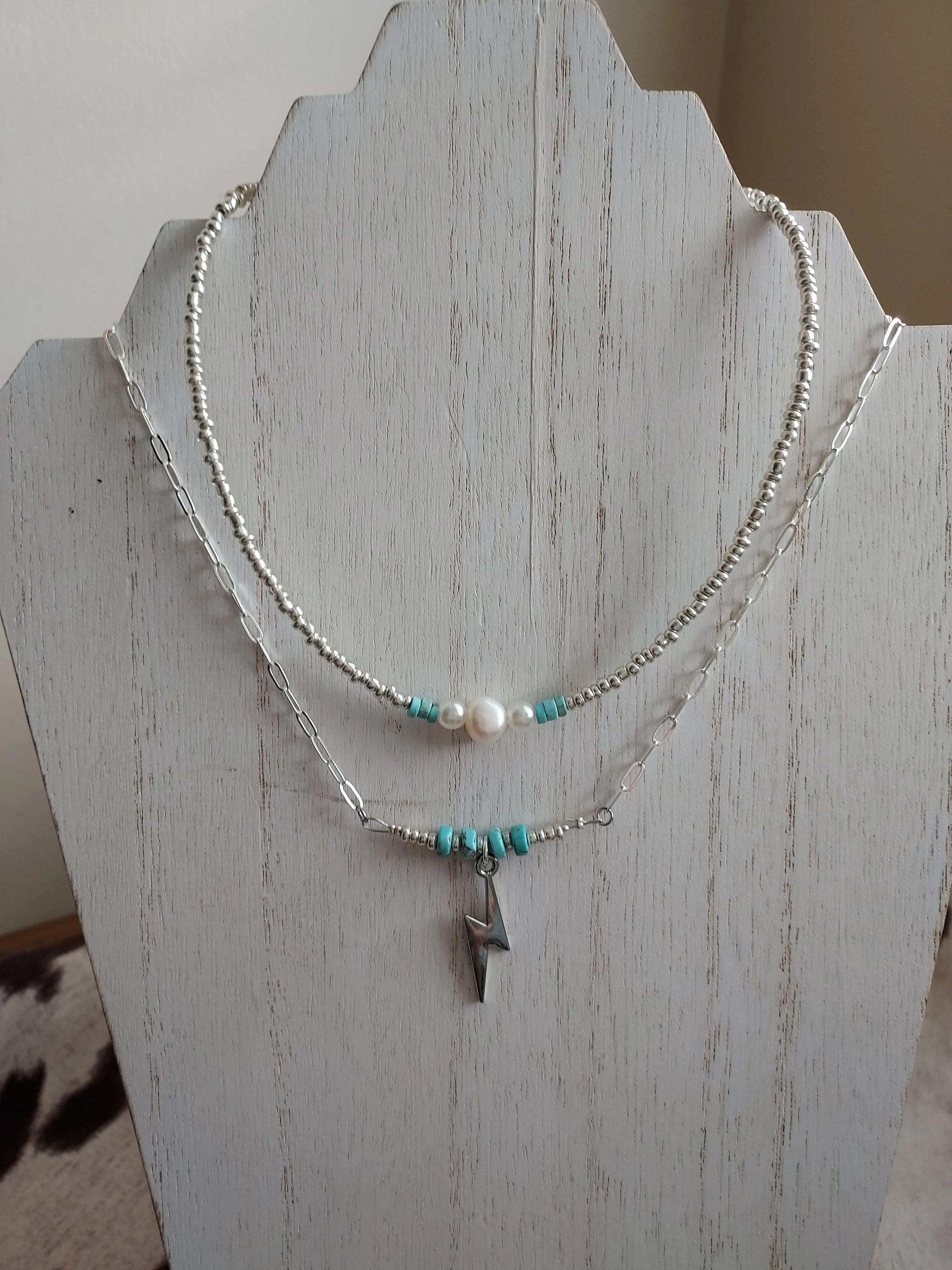 Lighting in the sky necklaces