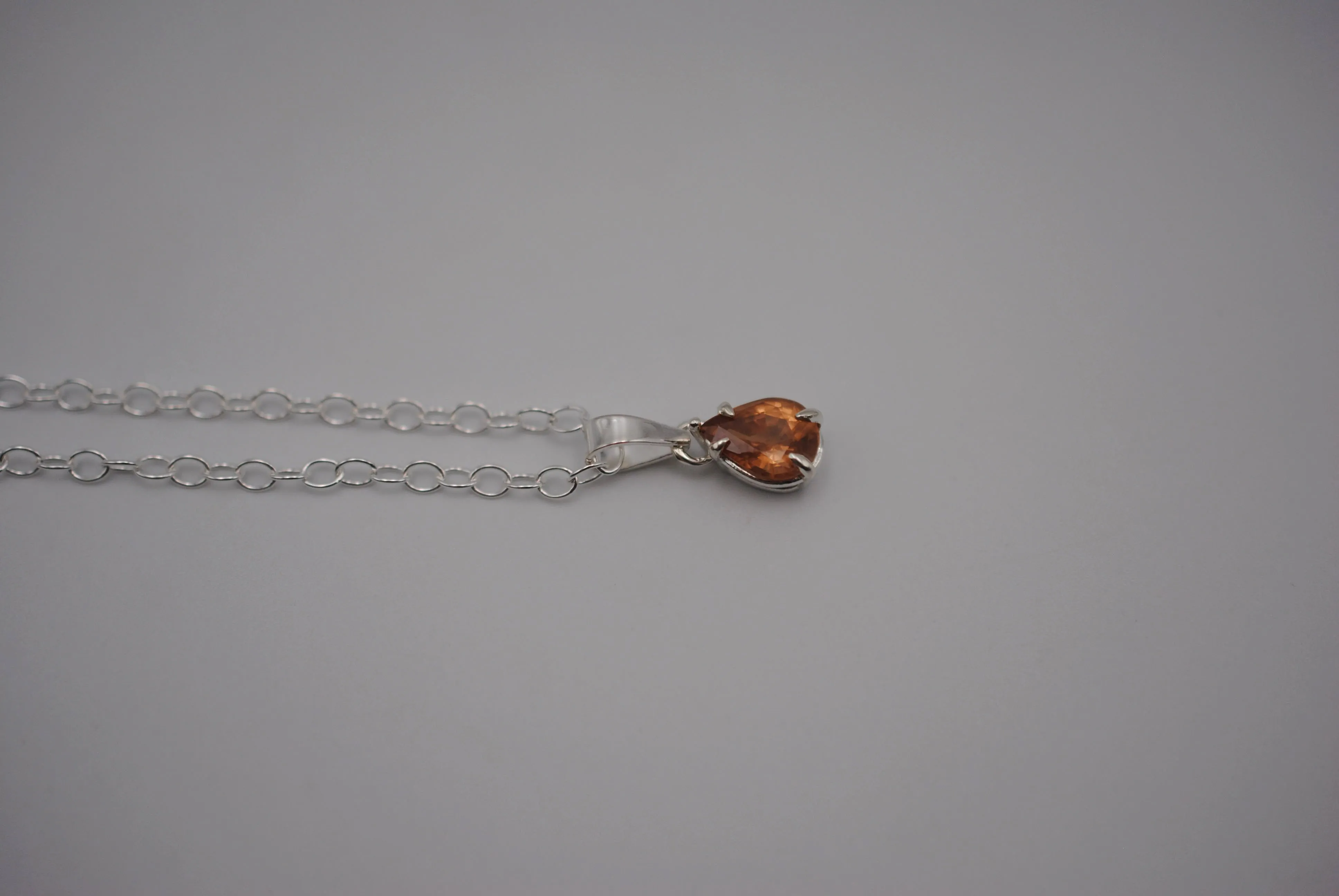 Malaia Garnet Necklace: Pear Cut, Silver Setting, Cable Chain