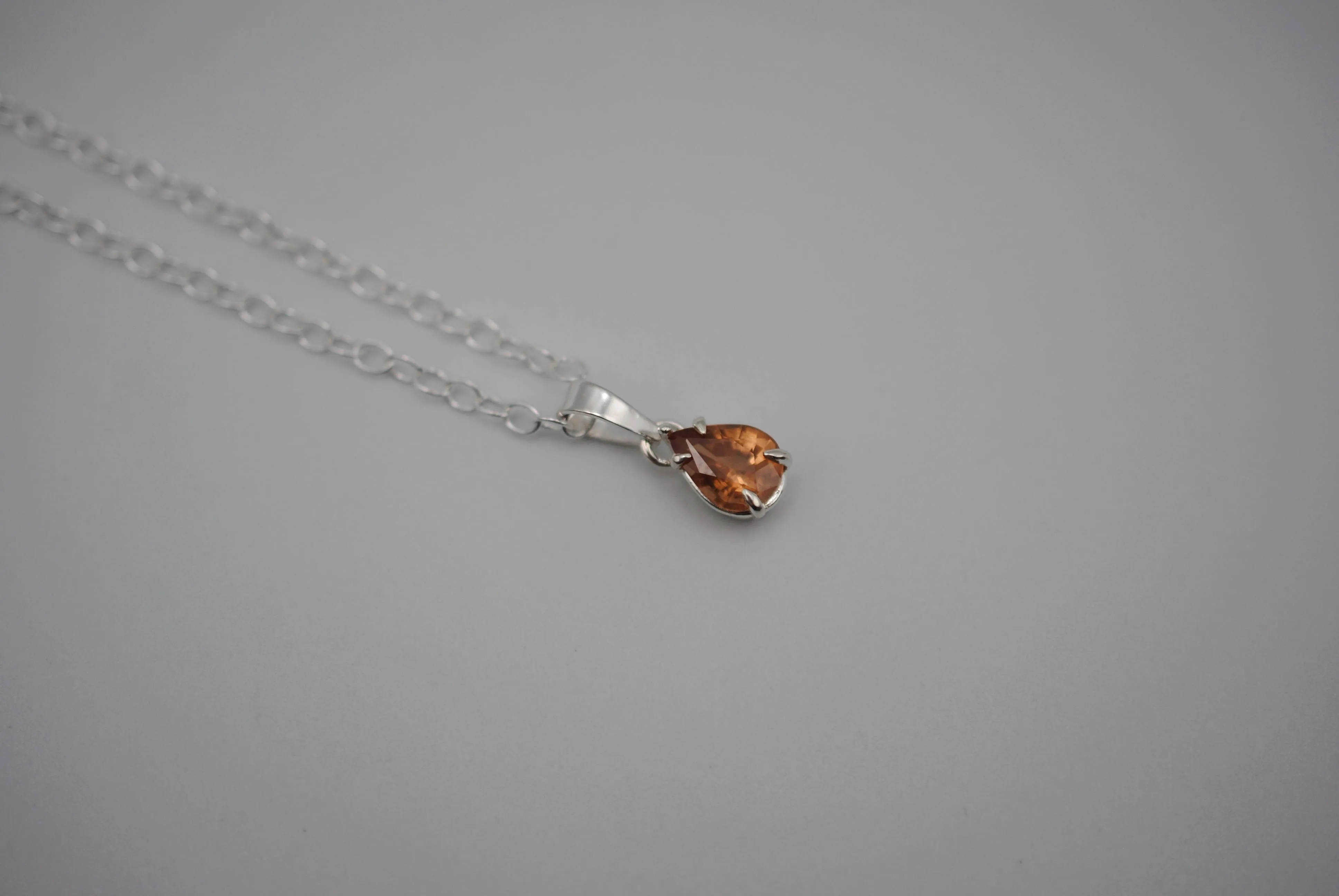 Malaia Garnet Necklace: Pear Cut, Silver Setting, Cable Chain