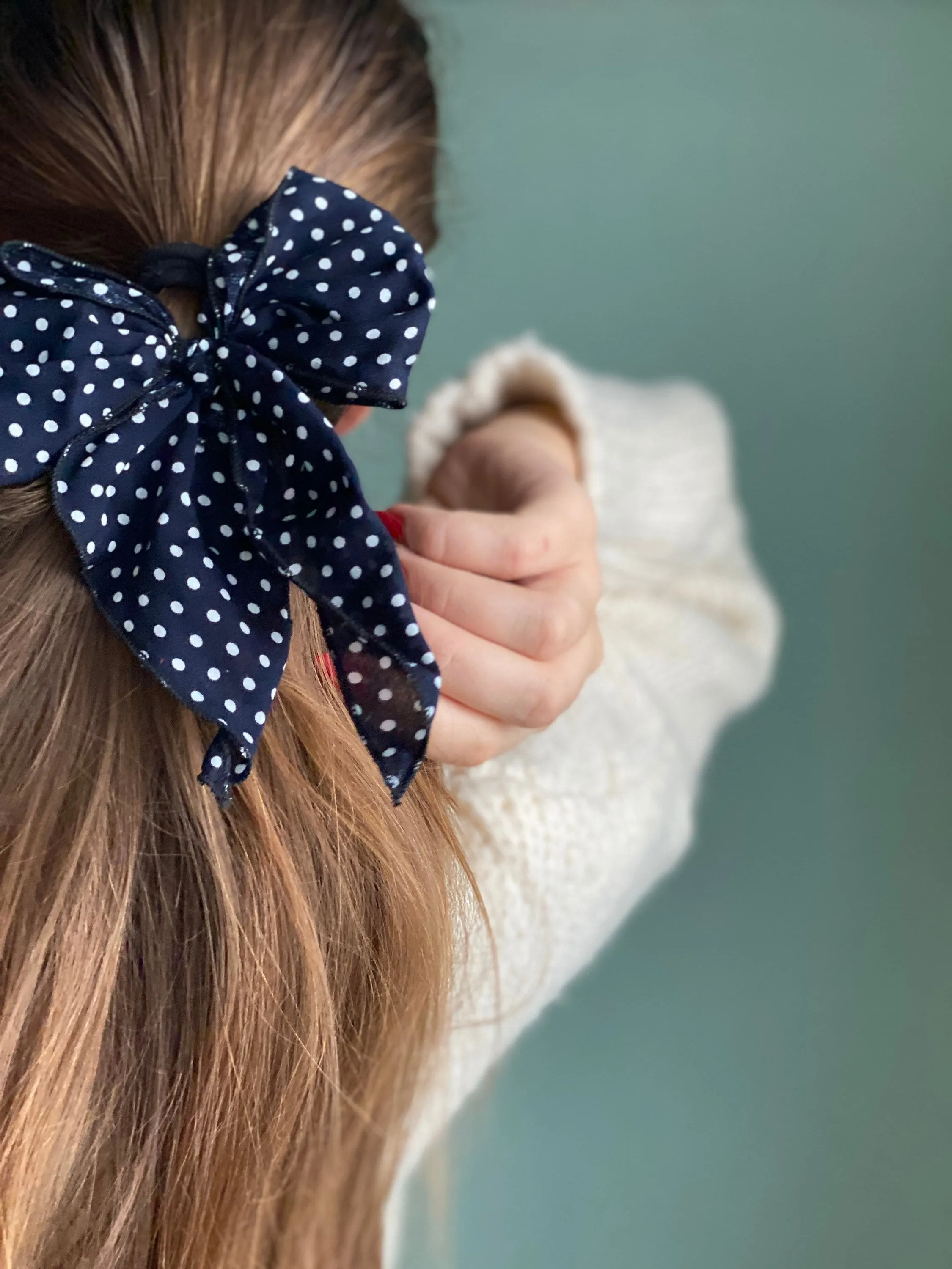 Navy blue polka dot hair bow
