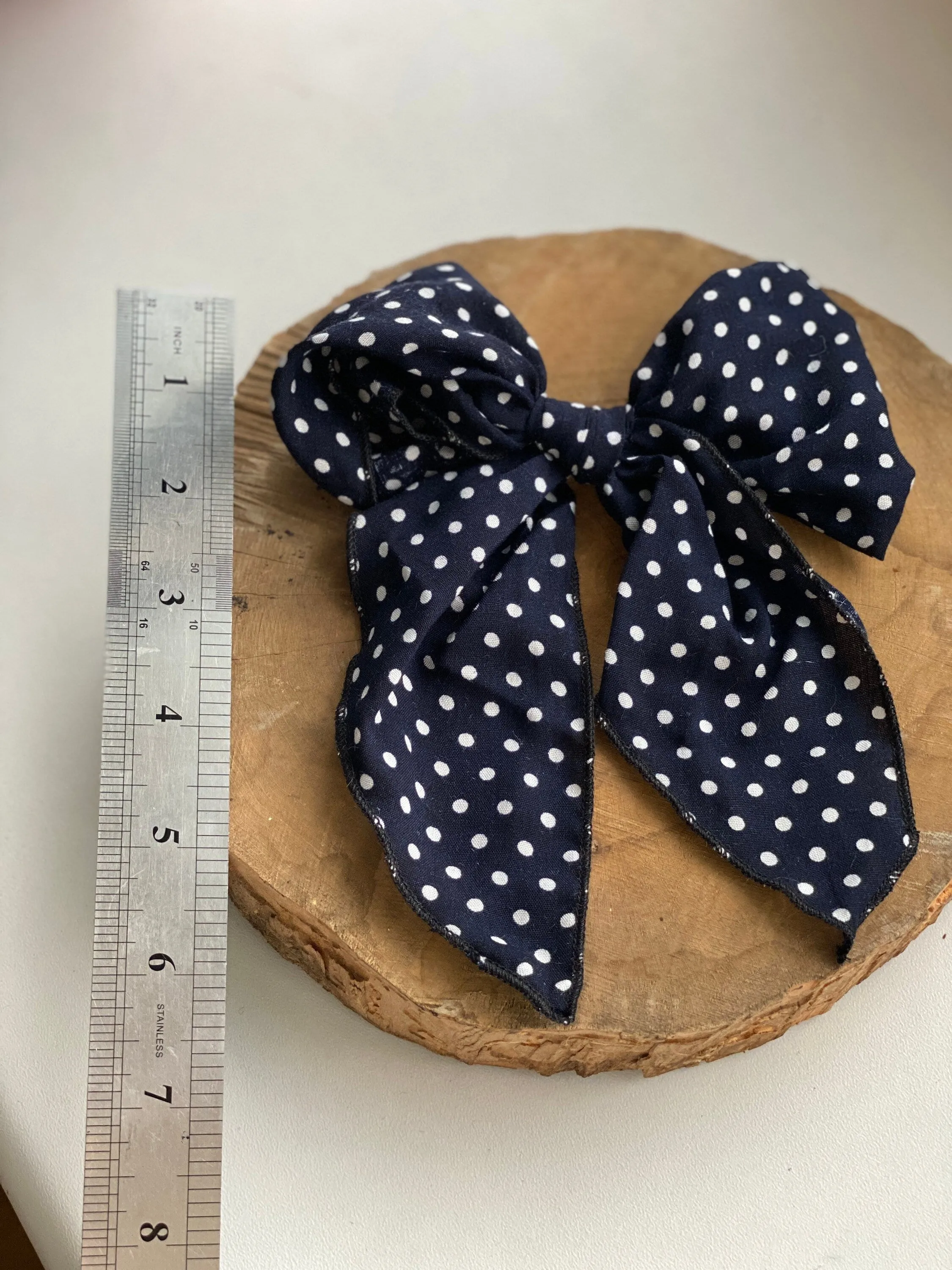 Navy blue polka dot hair bow